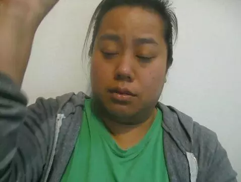 AI Video from prompt: The woman rolls up both of her hoodie sleeves