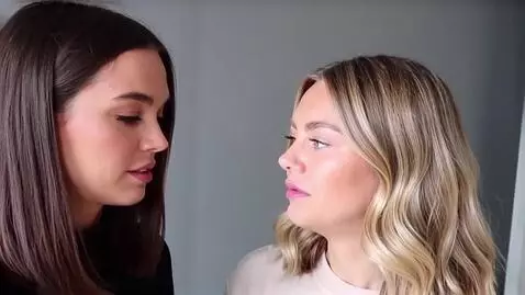 AI Video from prompt: Two girls with huge fat lips so close to each ot