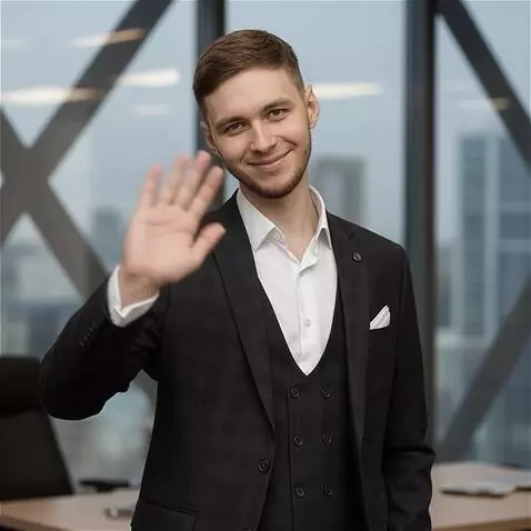 AI Video from prompt: A man standing in a formal suit from the uploade