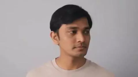 AI Video from prompt: A realistic Indian man in his 30s, medium brown 