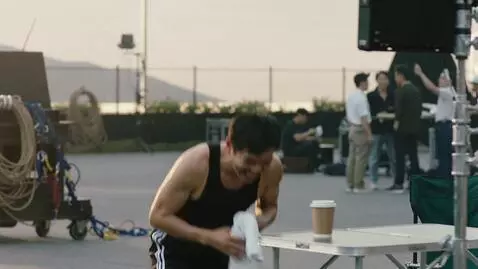 AI Video from prompt: Bloopers with Jackie Chan, he laughs after a fai