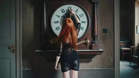 AI Video from prompt: A girl with long red hair in a black transparent