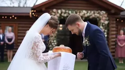 AI Video from prompt: A young woman, the bride, in a wedding dress, bo