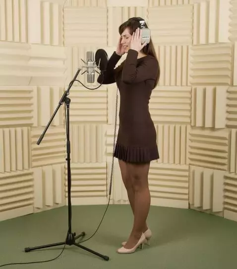 AI Video from prompt: A woman wearing headphones sings intently. with 