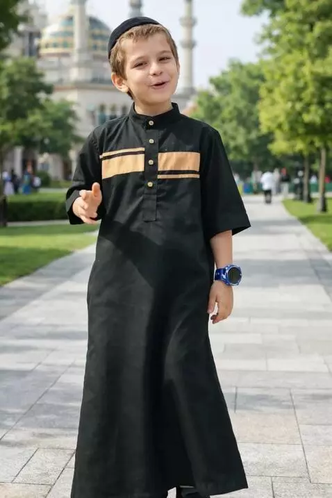 AI Video from prompt: a child appears happy wearing a new robe while p