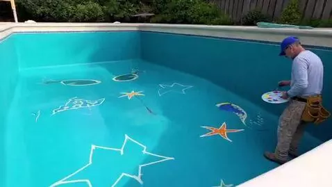 AI Video from prompt: The workers paint the pool with special water-re