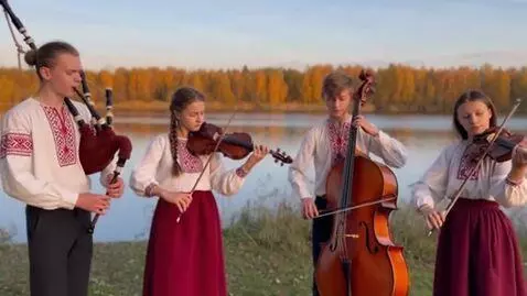 AI Video from prompt: Young musicians, boys and girls, wearing embroid