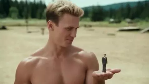 AI Video from prompt: A blond, muscular military man, wearing only arm