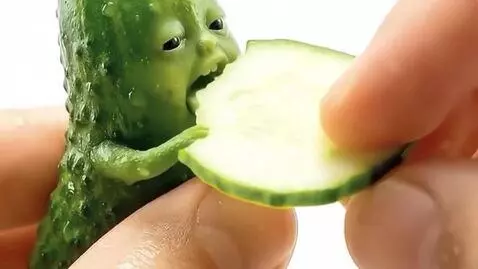AI Video from prompt: Make this pickle eat the cucumber slice like in 