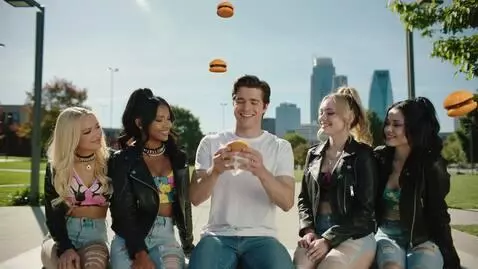 AI Video from prompt: the man in the video starts eating burgers that 