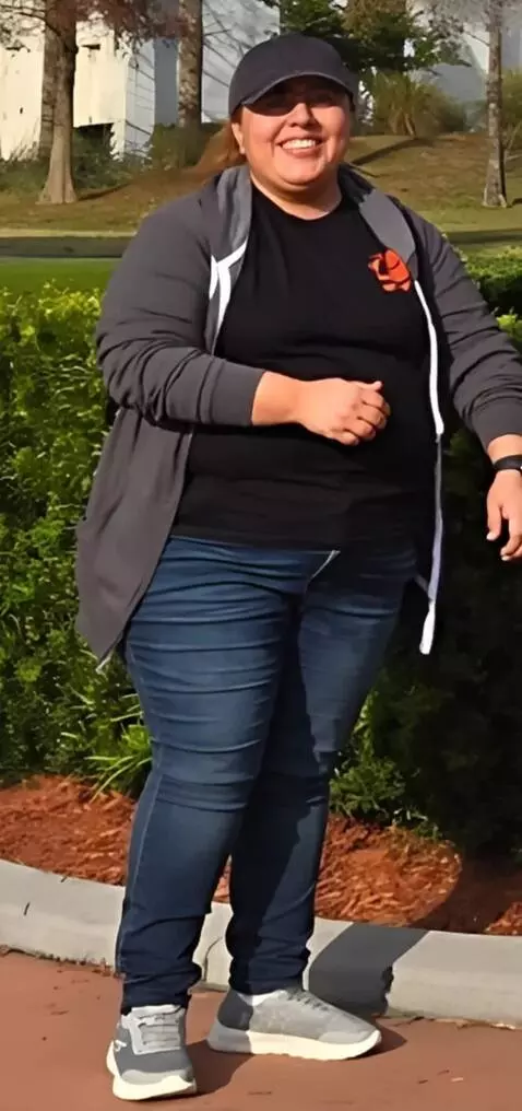 AI Video from prompt: The woman rolls all the way up both of her hoodi