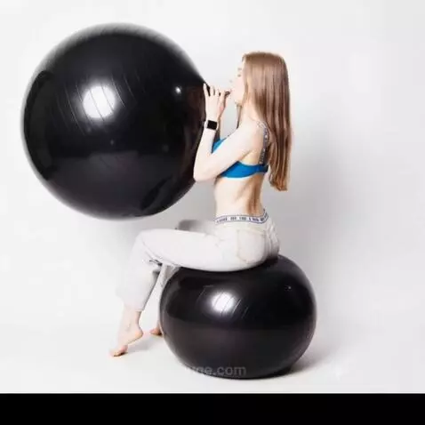 AI Video from prompt: Women from photo blowing gym ball from average s