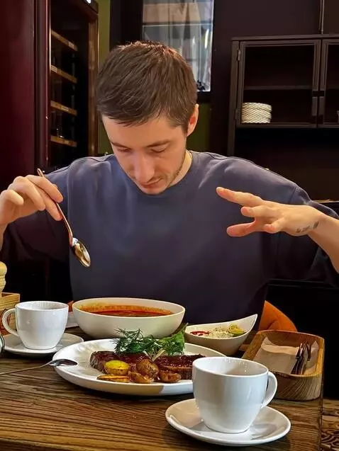 AI Video from prompt: This man tries to eat soup with a spoon, but it 