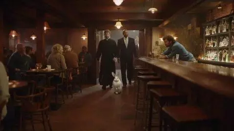AI Video from prompt: Cinematic comedy scene in a cozy old bar at nigh