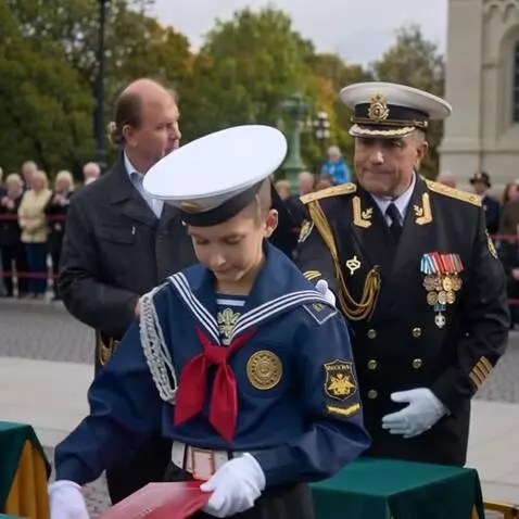 AI Video from prompt: The officer is shaking hands with the boy and co