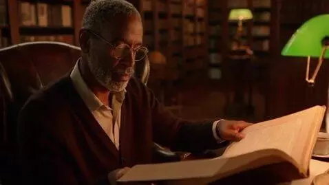 AI Video from prompt: A mature African American male  sitting in his l