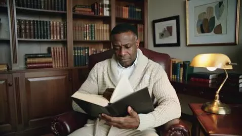 AI Video from prompt: A mature African American male  sitting in his l