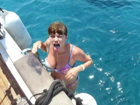 AI Video from prompt: The girl opens her mouth and sticks out her tong