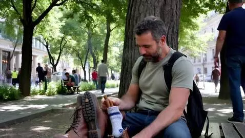 AI Video from prompt: In a bustling city park, a rugged yet kind-eyed 