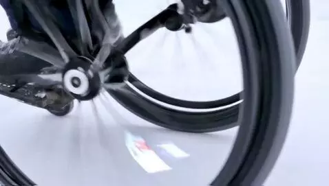 AI Video from prompt: A person in a compact wheelchair with four wheel