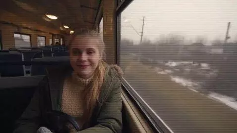 AI Video from prompt: A young Russian woman named Katya is filming an 