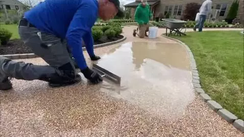 AI Video from prompt: On the territory of a country house, workers lay