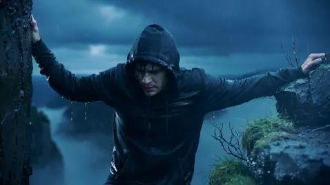 AI Video from prompt: It's evening, it's raining, and a guy in a black