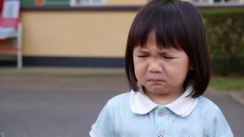 AI Video from prompt: A child goes to kindergarten with a unhappy face