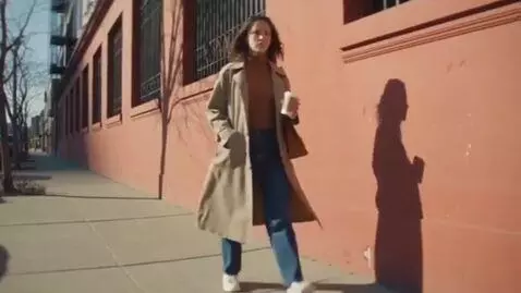 AI Video from prompt: A woman is walking and her shadow stops; some ti
