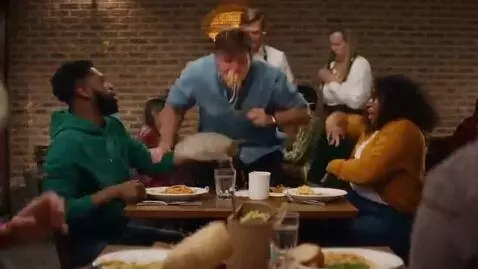 AI Video from prompt: A hilarious food fight erupts in the middle of a