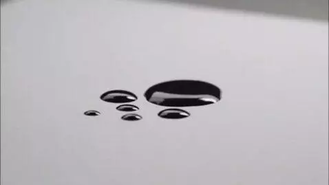 AI Video from prompt: Show a white sheet of paper, with blank ink drop