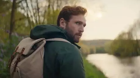 AI Video from prompt: Adorable Corgi puppy chasing a duck near a tranq