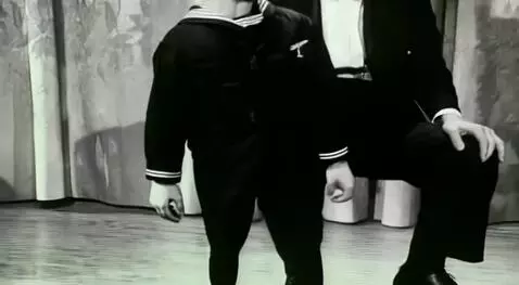 AI Video from prompt: the doll runs away quickly, and the man is left 