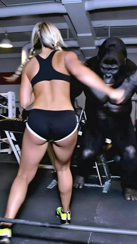 AI Video from prompt: BOXING GIRL FIGHTS A GORILLA IN THE RING