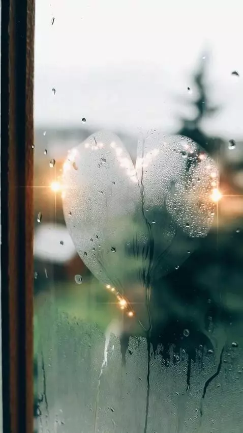 AI Video from prompt: A heart shape made from condensation on the wind