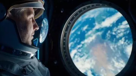 AI Video from prompt: An astronaut looks at the Earth from a space mod