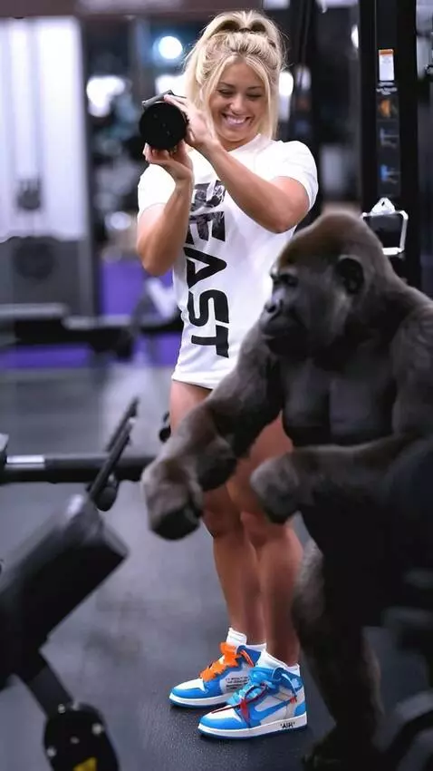 AI Video from prompt: Gorilla dancing a shuffle in front of a girl, gi