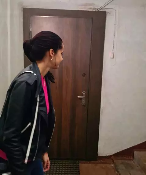 AI Video from prompt: The smiling woman pivots away from her photo pos