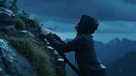 AI Video from prompt: Evening, rain, a young guy in a black hoodie, ha