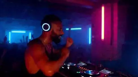 AI Video from prompt: Dynamic DJ pumps up ecstatic crowd with hard pho