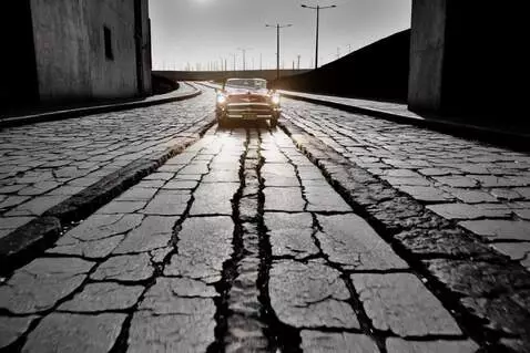 AI Video from prompt: A black-and-white street in a big city at night,