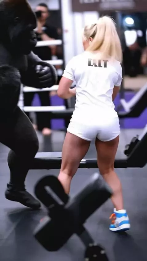 AI Video from prompt: A girl boxer in a skirt spars with a gorilla in 