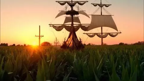 AI Video from prompt: Looking over a corn field at the sunset with tel