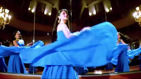 AI Video from prompt: A beautiful woman dancing in a blue dress with a