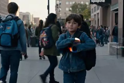 AI Video from prompt: Spokane backpack boy acting tough