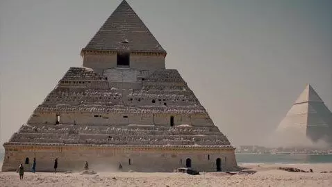 AI Video from prompt: I want the pyramids walking or flying ir swimmin
