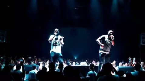 AI Video from prompt: Concert scene with rap artists on the mic