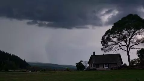 AI Video from prompt: A remote village night sky with a house and tree