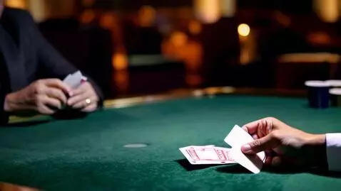 AI Video from prompt: man playing blackjack while  camera pans right