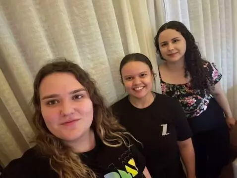 AI Video from prompt: The three girls turn around, their pants fall.